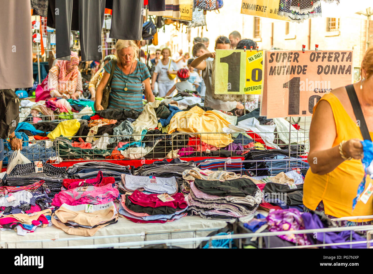 FERRARA, ITALY - AUGUST 24, 2018: Tourists and locals have fun shopping in  the weekly market Stock Photo - Alamy