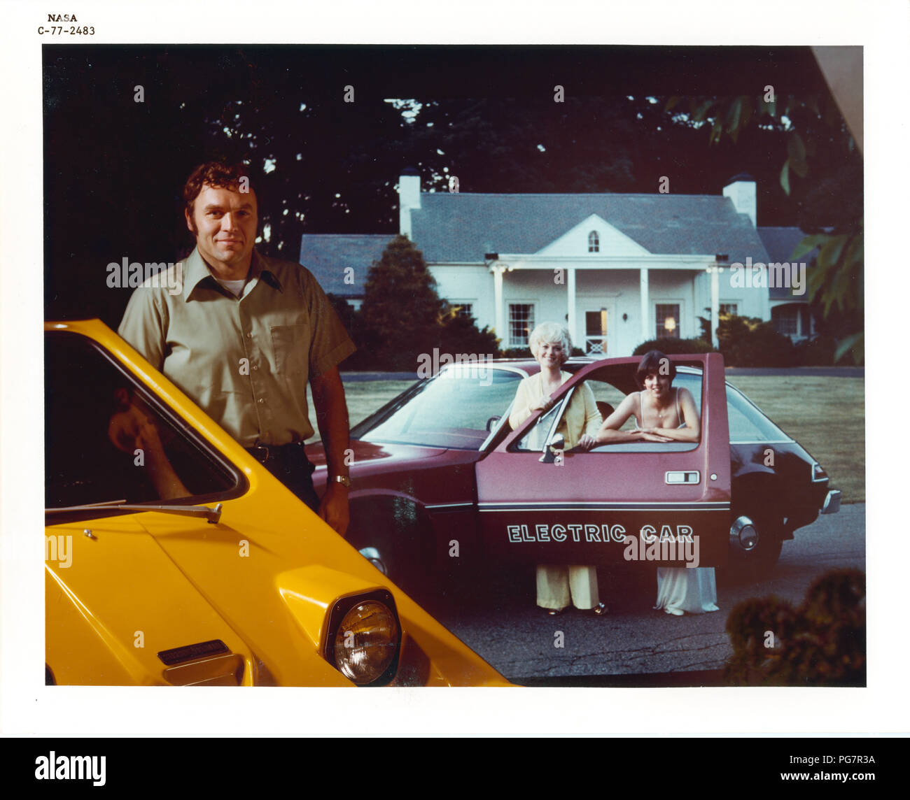 J BOZEK AND R SOLTIS WITH ELECTRIC CAR 1977 Stock Photo