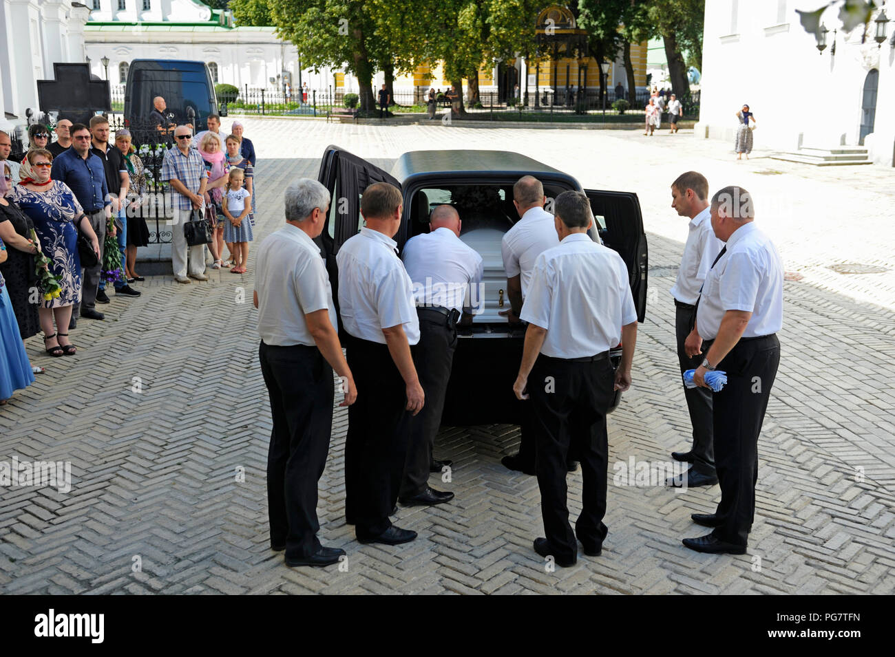 funeral-home-workers-carrying-a-coffin-with-a-late-inside-for-burial