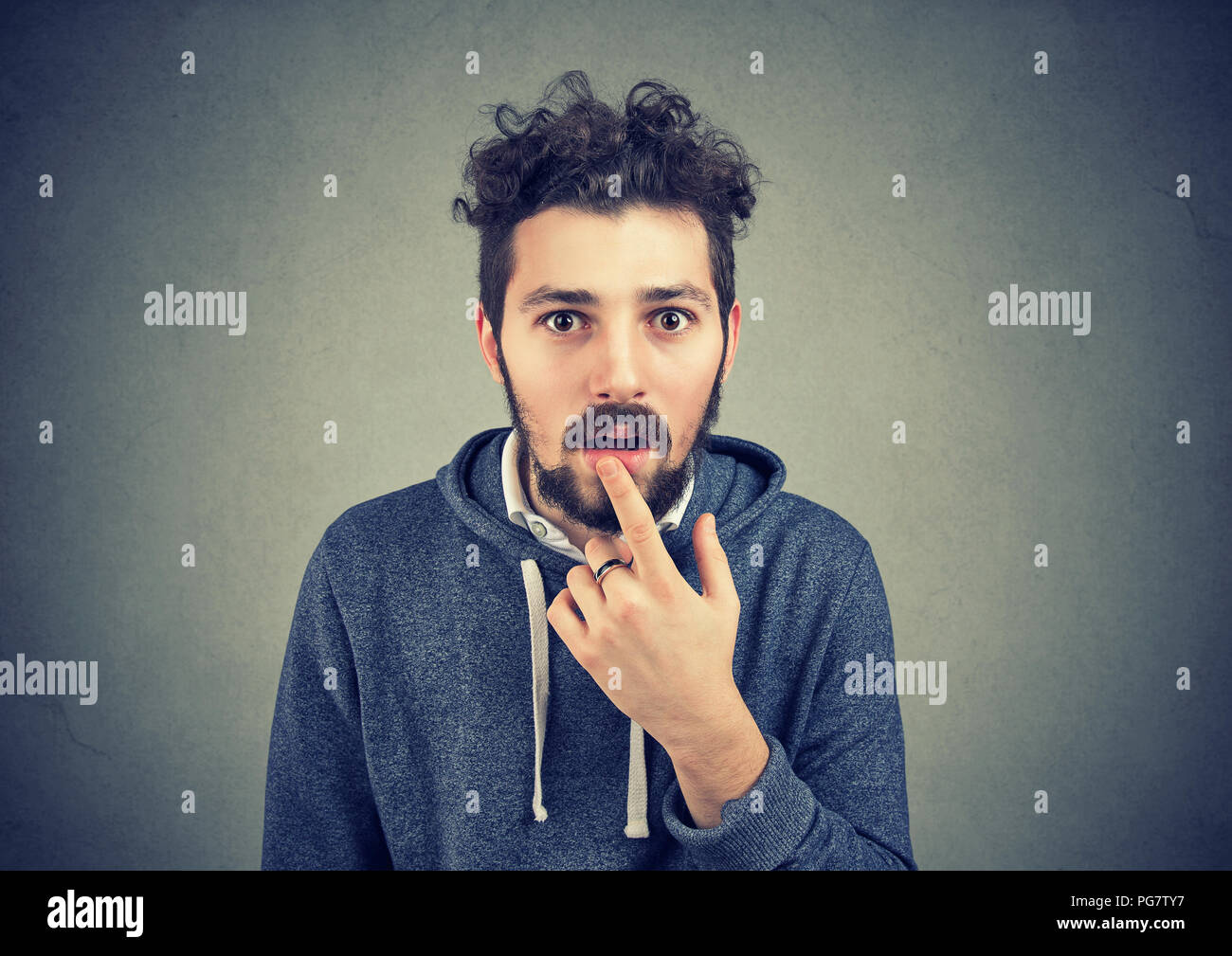 Amazed stunned young man looking at camera Stock Photo