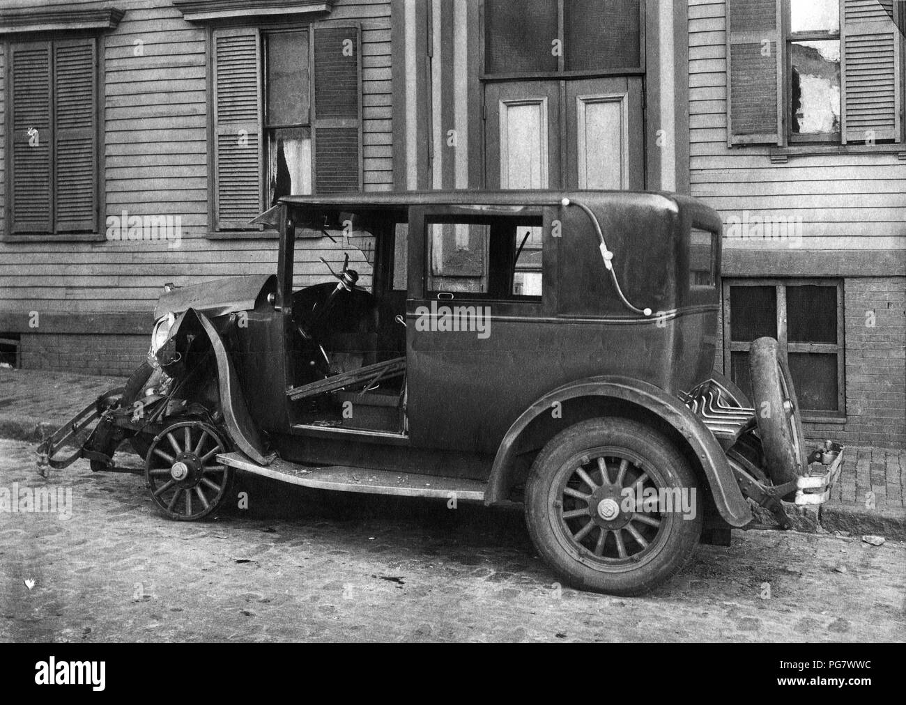 This photograph is a view of the left side of the wrecked automobile. 1927 Stock Photo