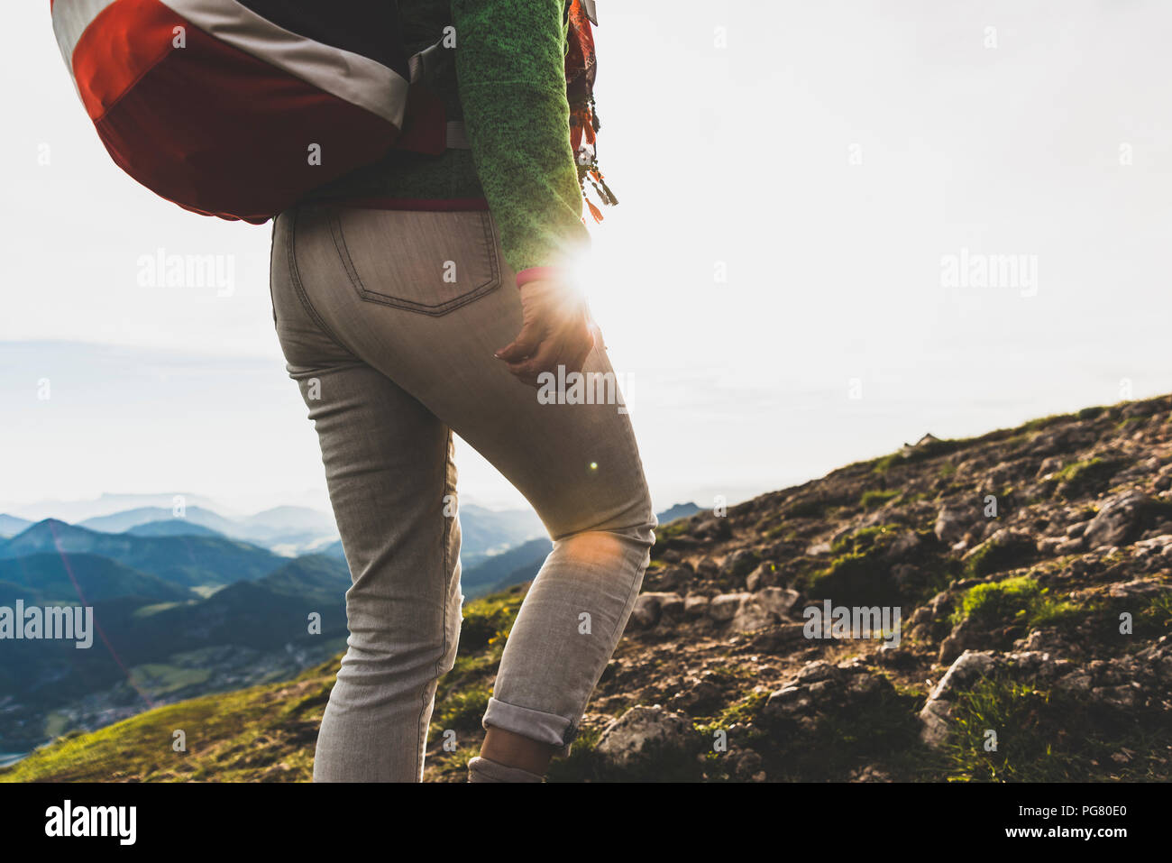 Austria, Salzkammergut, Hiker with backpack hiking in the Alps Stock Photo