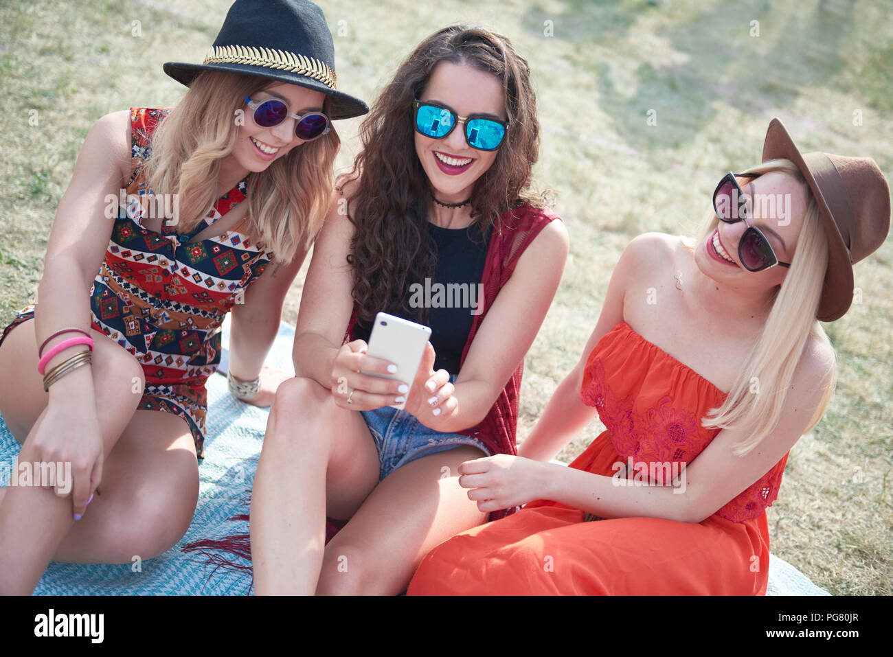 Happy friends making selfie at music festival Stock Photo