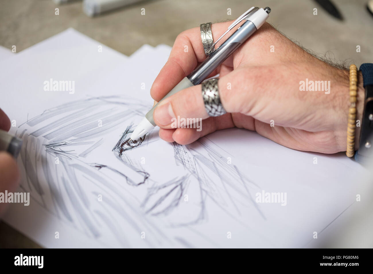 Close-up of artist drawing a sketch Stock Photo
