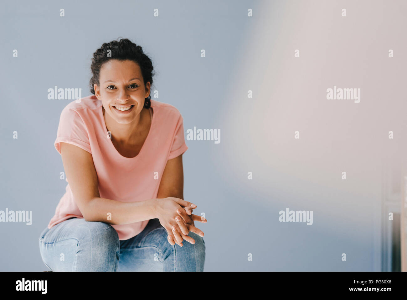 Confident woman smiling happily Stock Photo