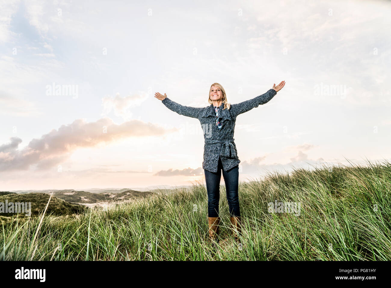 Raised arms woman hi-res stock photography and images - Alamy