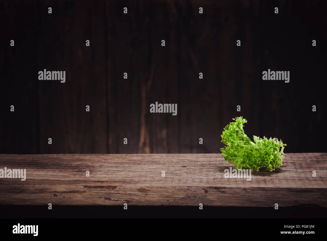 Lettuce leaf on wood Stock Photo