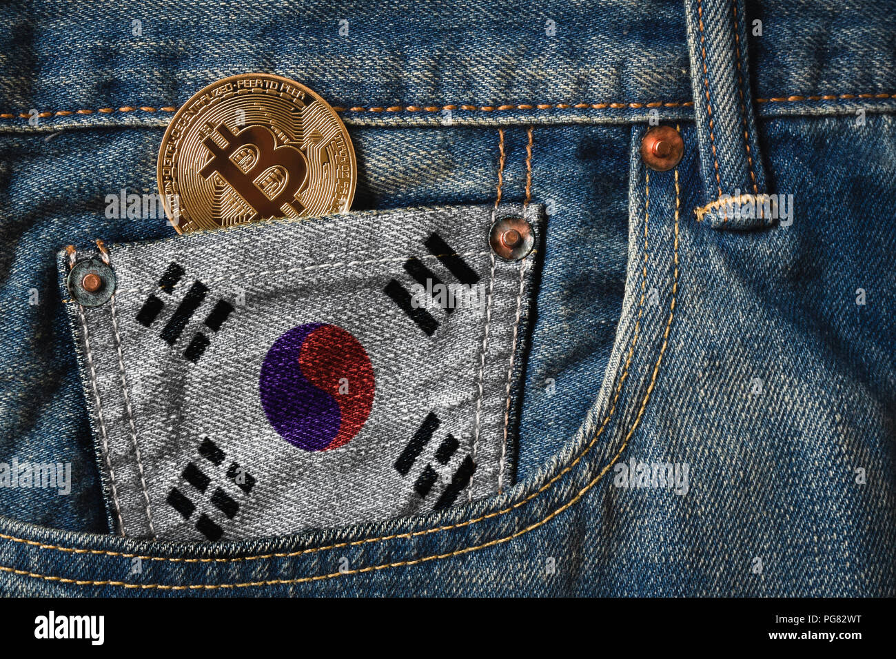 Golden BITCOIN (BTC) cryptocurrency in the pocket of jeans with the flag of  South Korea Stock Photo - Alamy