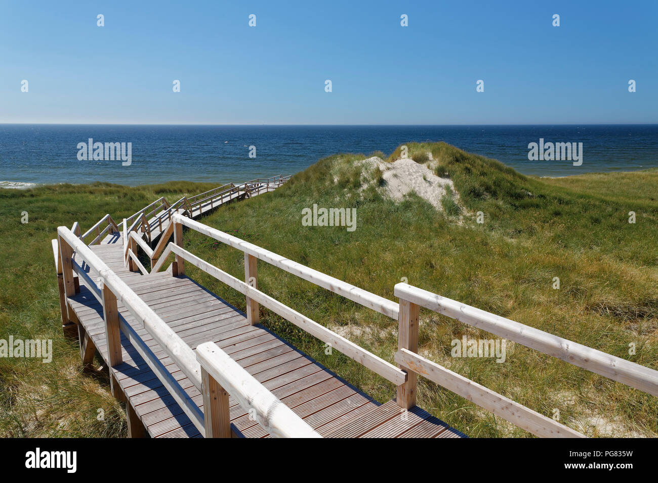 Germany, North Frisia, Sylt, Boardwalk to Kampen beach Stock Photo