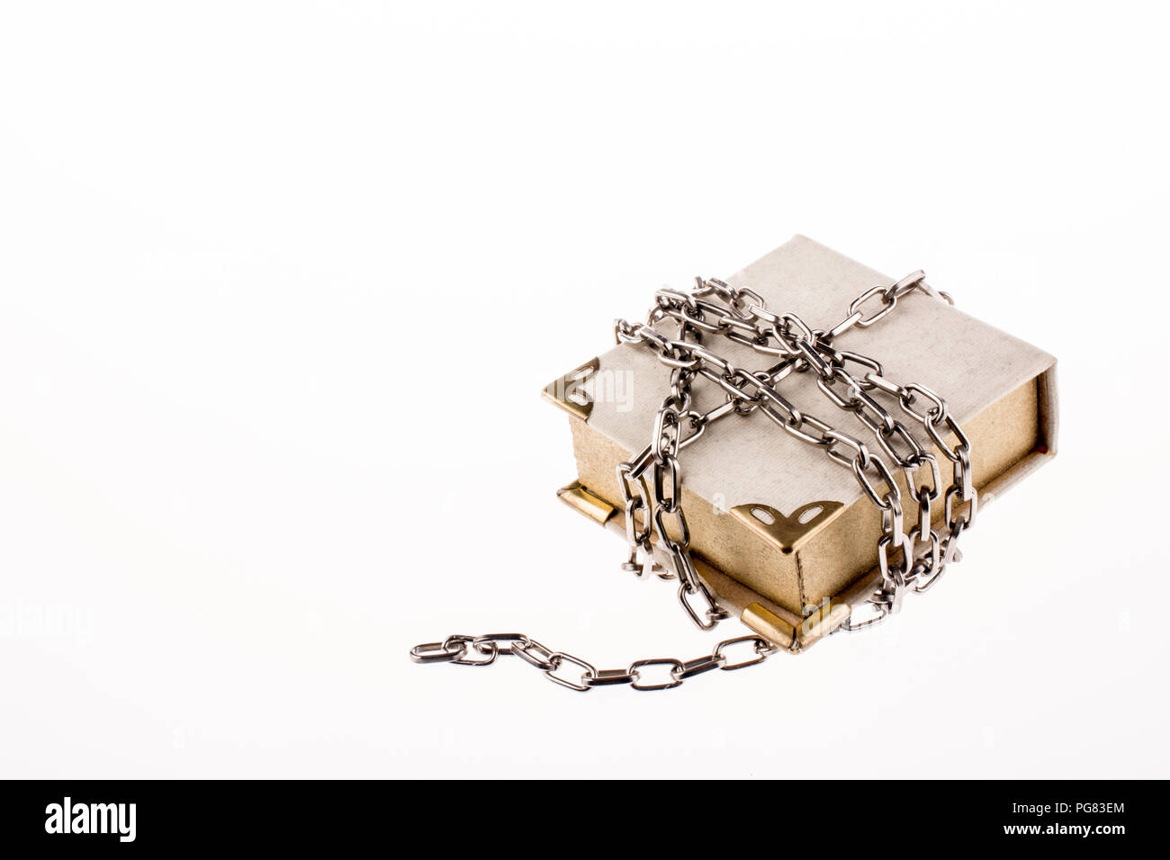 Chained book on white background Stock Photo