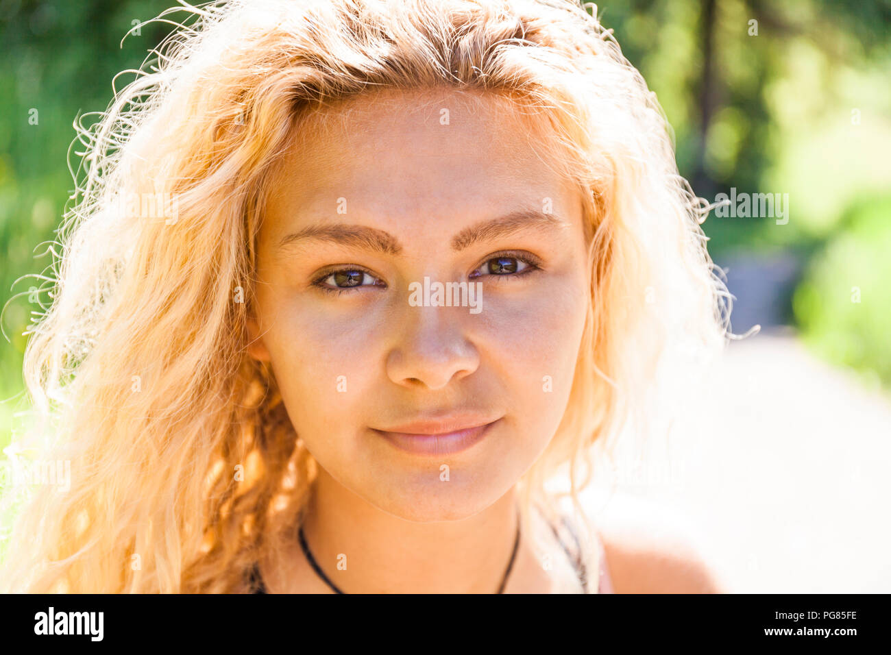 Portrait of smiling blond woman Stock Photo