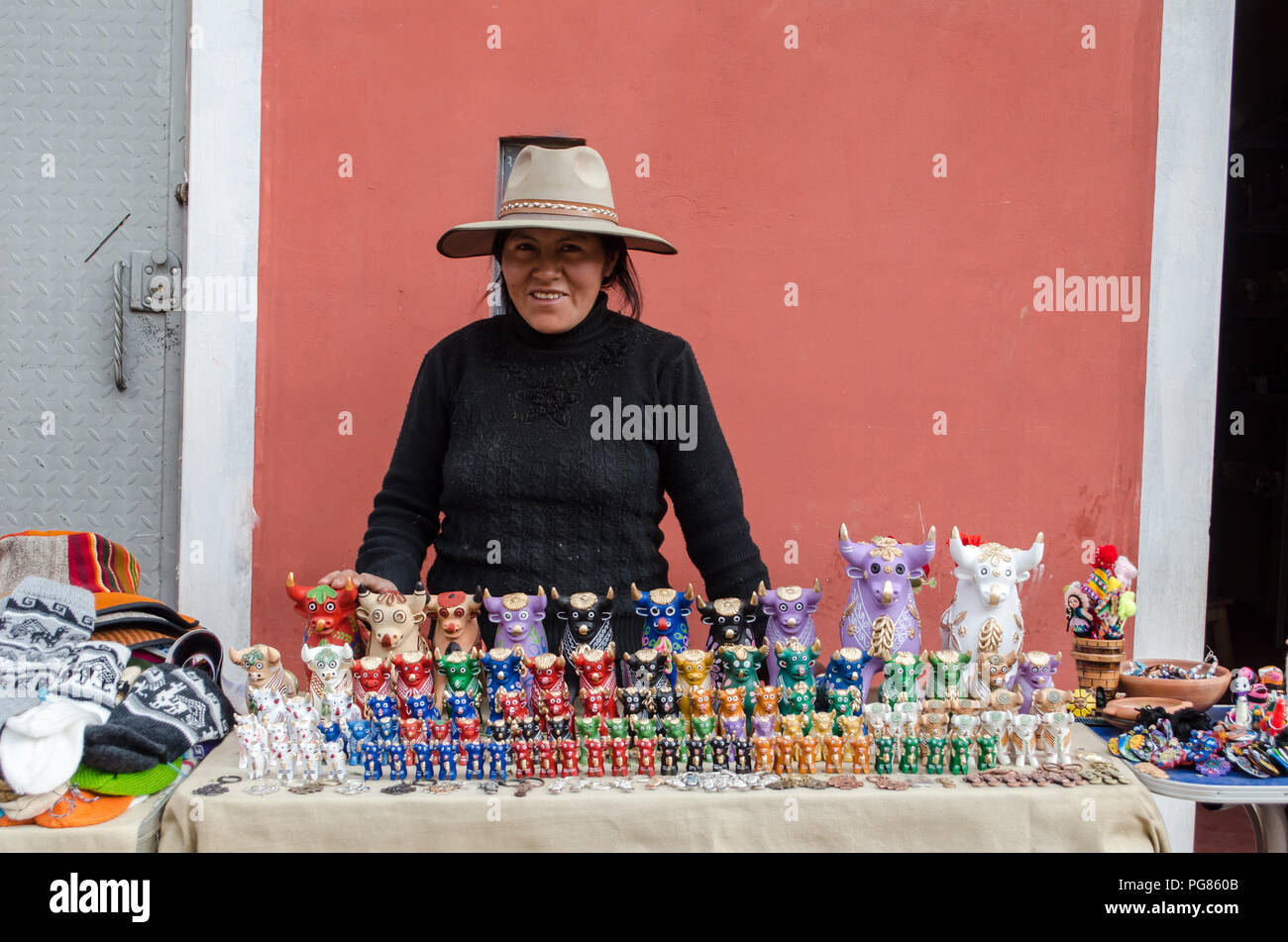 Woman selling Toritos de Pucara at Pucara Town in Peru Stock Photo