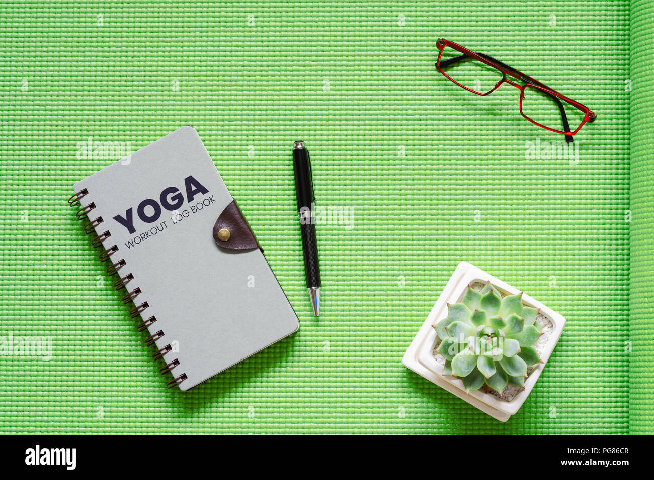 yoga workout log book concept flat lay top view of yoga workout log workout log book