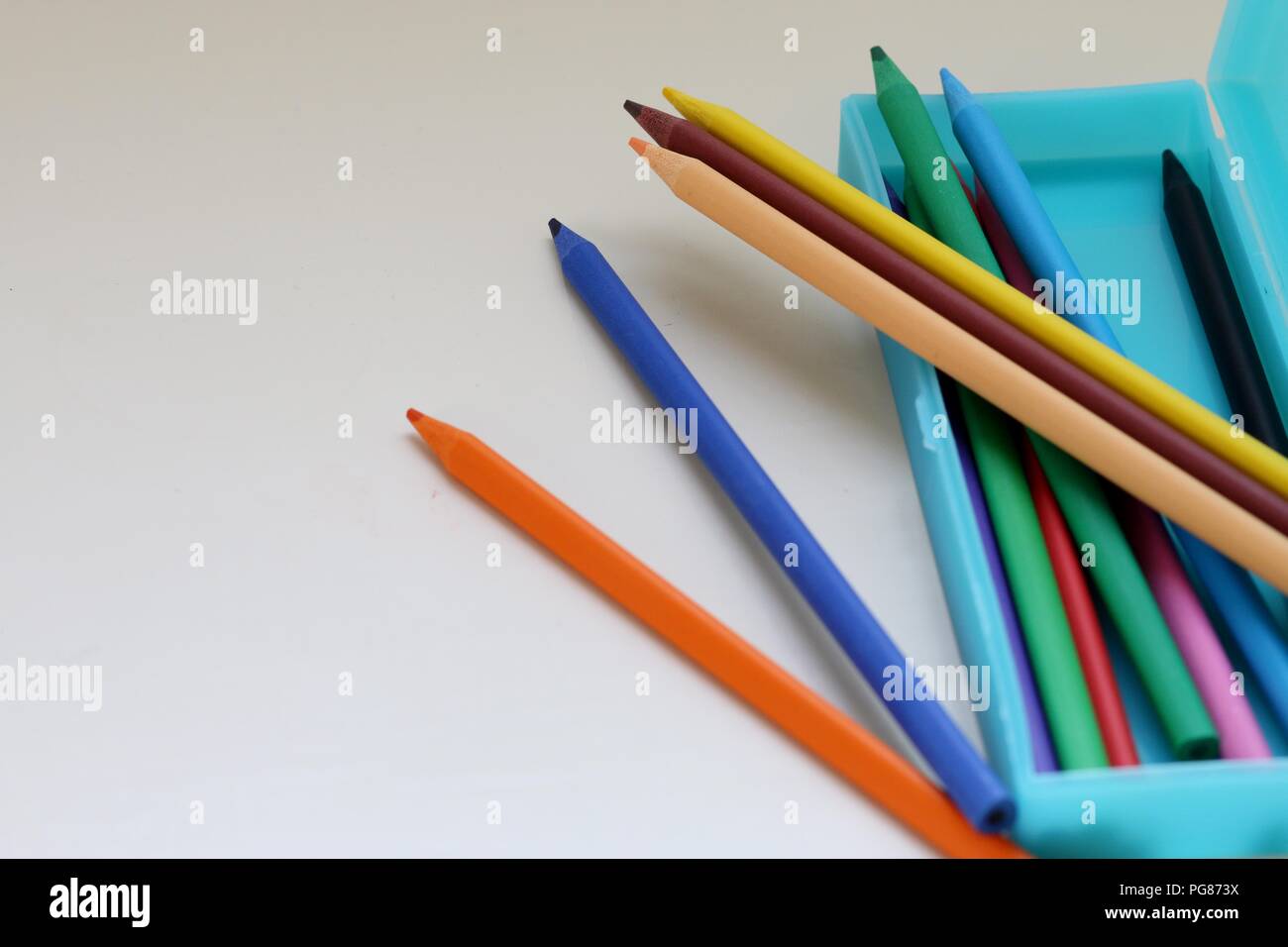Colored pencils in a light blue pencil case Stock Photo Alamy