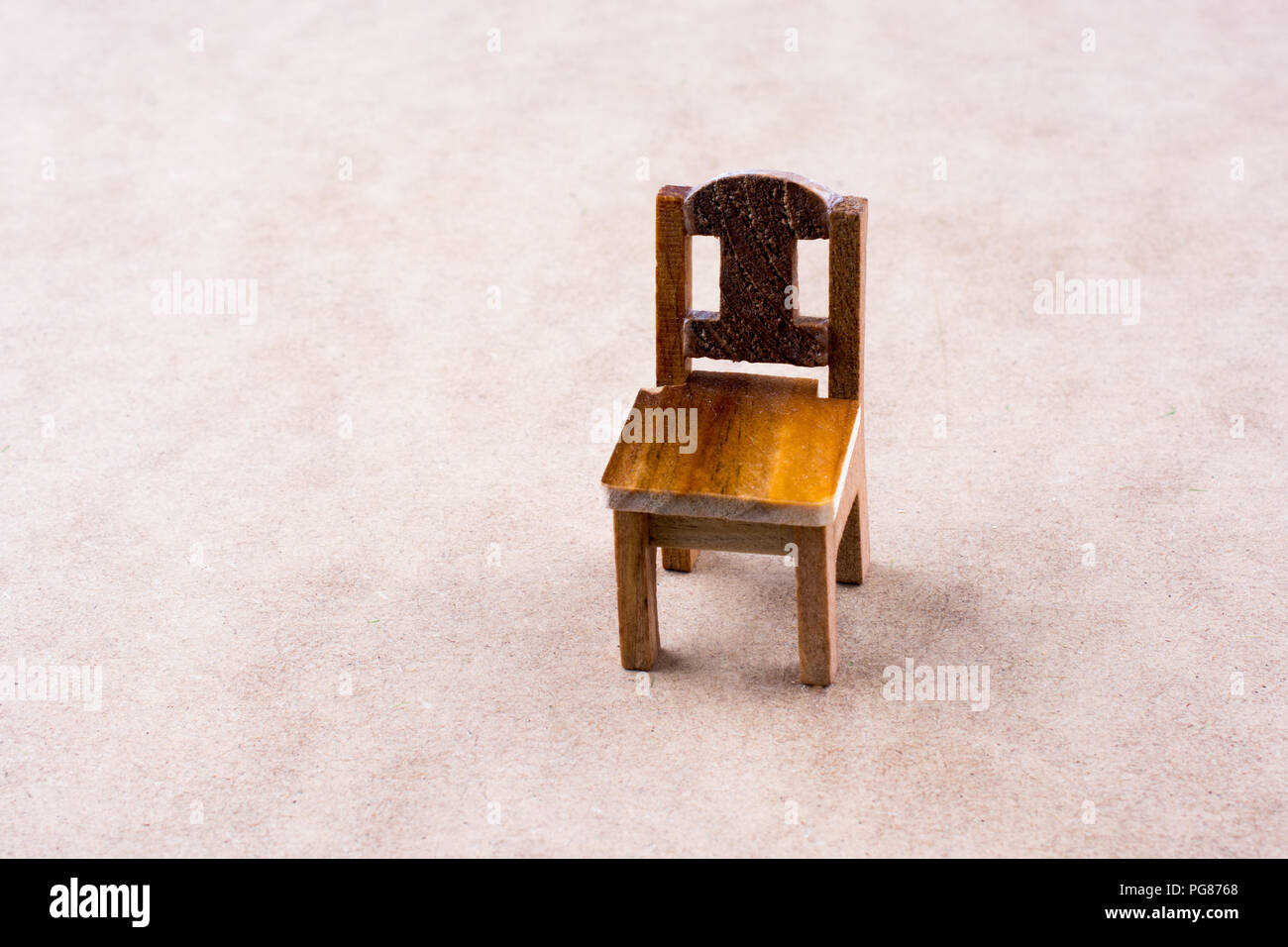 Little model wooden chair on the floor Stock Photo Alamy