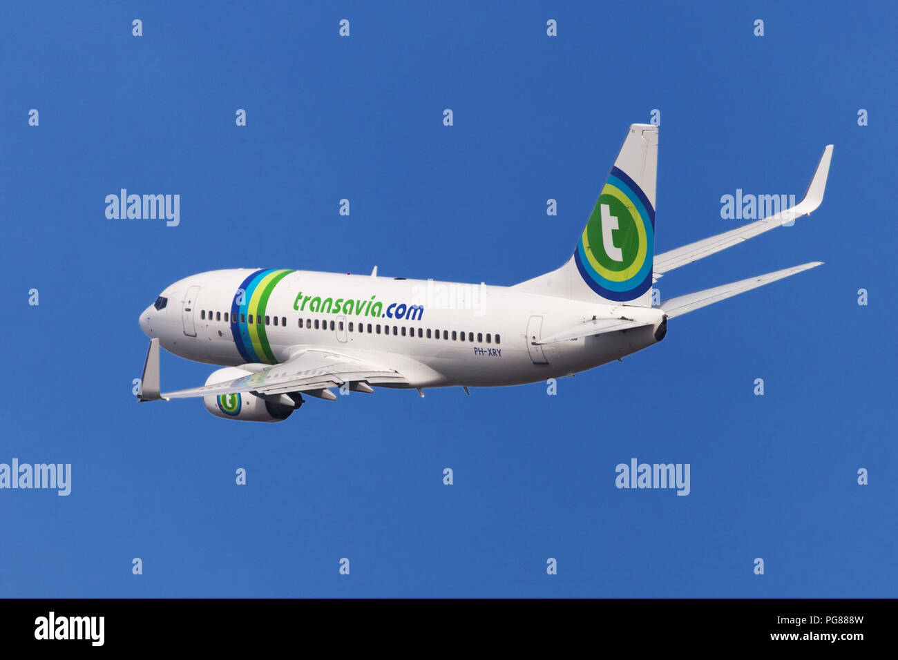 Barcelona, Spain - August 21, 2018: Transavia Boeing 737-700 banking left after taking off from El Prat Airport in Barcelona, Spain. Stock Photo