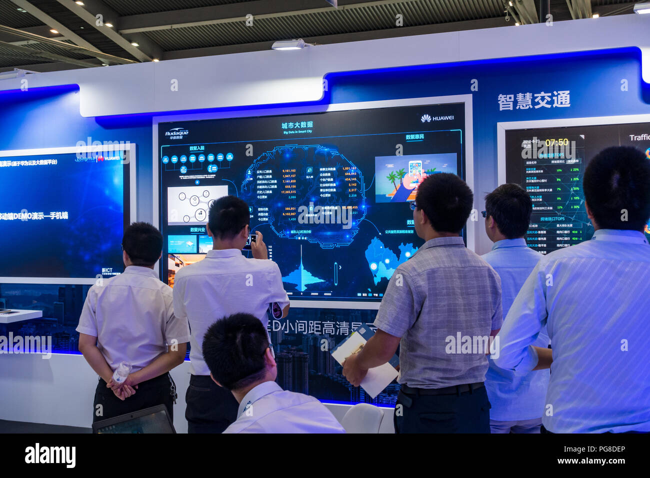Smart city exhibits, urban big data, digital control systems, hi-tech monitoring technology, people at Fourth China Smart City Expo 2018 in Shenzhen, China. Stock Photo
