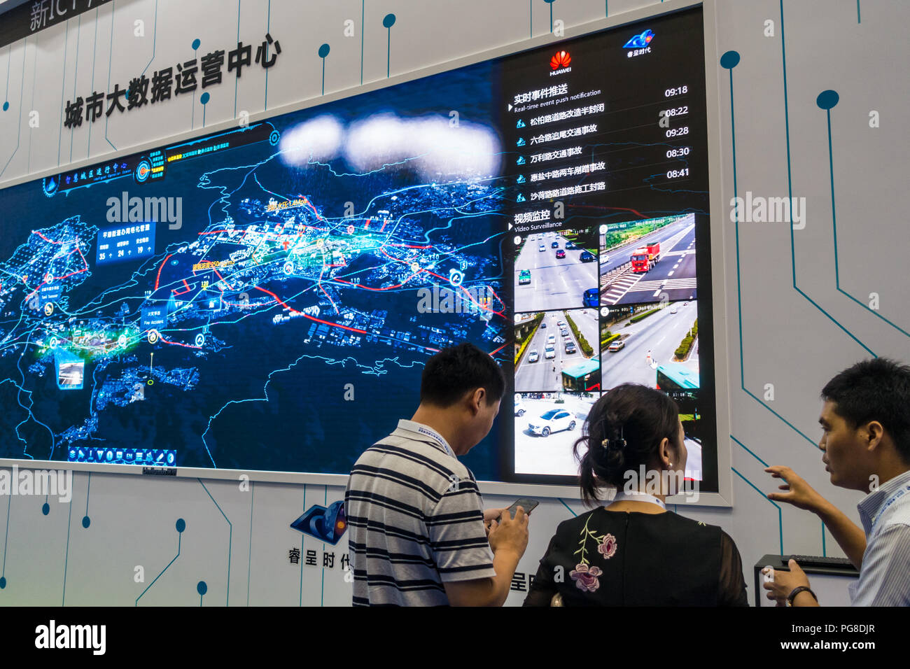 Smart city exhibits, urban big data, digital control systems, hi-tech monitoring technology, people at Fourth China Smart City International Expo 2018 in Shenzhen, China. Stock Photo