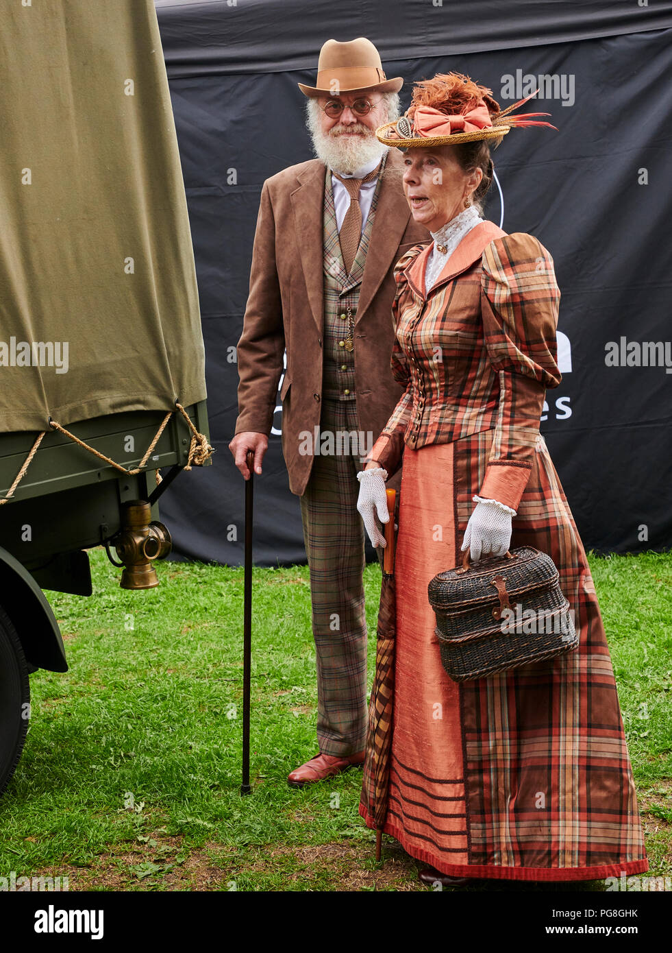 Llandrindod Wells, Powys, Wales UK. 20th to 26th August 2018 . A Gentleman and Lady in Victorian Dress at the Temple Gardens site in Lllandrindod Wells During the  37th Victorian Festival. Credit: Phillip Thomas/Alamy Live News Stock Photo