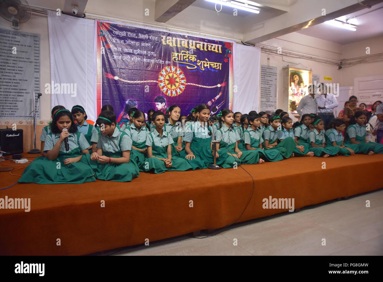 Mumbai, Maharastra, India. 24th Aug, 2018. Blind kids seen singing during the ceremony.Raksha Bandhan ceremony at Shreemati Kamla Mehta Dadar School for the Blind. During the ceremony blind kids tie Rakhi (thread of brother sister bonding) to deaf and dumb kids from Sadhana School for Deaf and Dumb in Mumbai. Credit: Sandeep Rasal/SOPA Images/ZUMA Wire/Alamy Live News Stock Photo