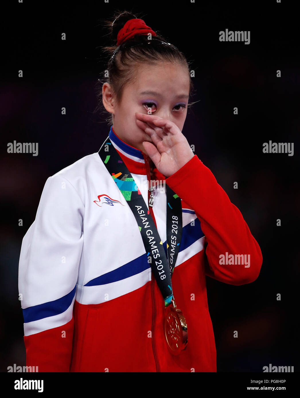 Jakarta. 24th Aug, 2018. Kim Su Jung of the DPRK wipes her tear during ...