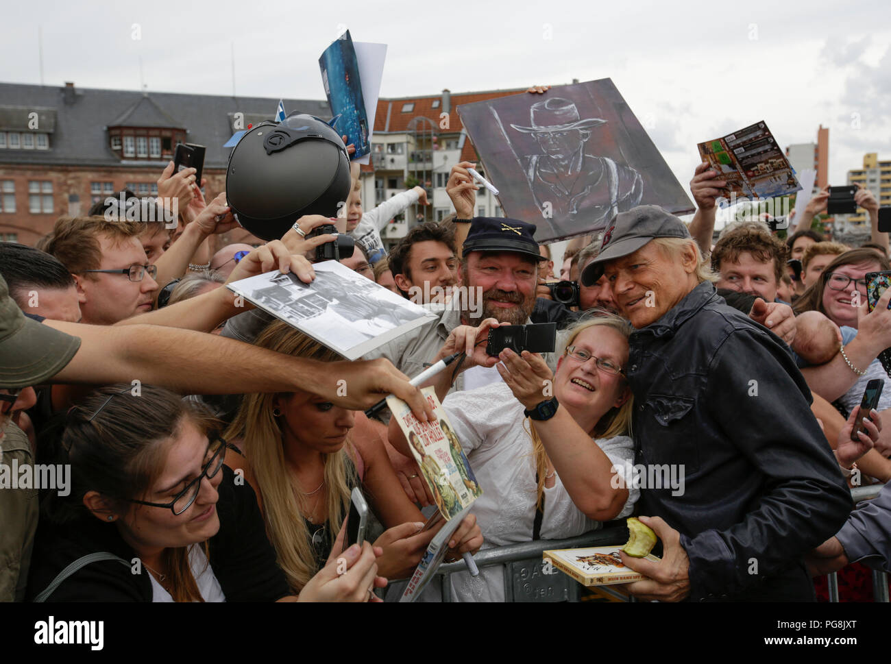 Worms, Germany. 24th August 2018. Terence Hill poses for a picture with his fans. Italian actor Terence Hill visited the German city of Worms, to present his new movie (My Name is somebody). Terence Hill added the stop in Worms to his movie promotion tour in Germany, to visit a pedestrian bridge, that is unofficially named Terence-Hill-Bridge (officially Karl-Kubel-Bridge). Stock Photo