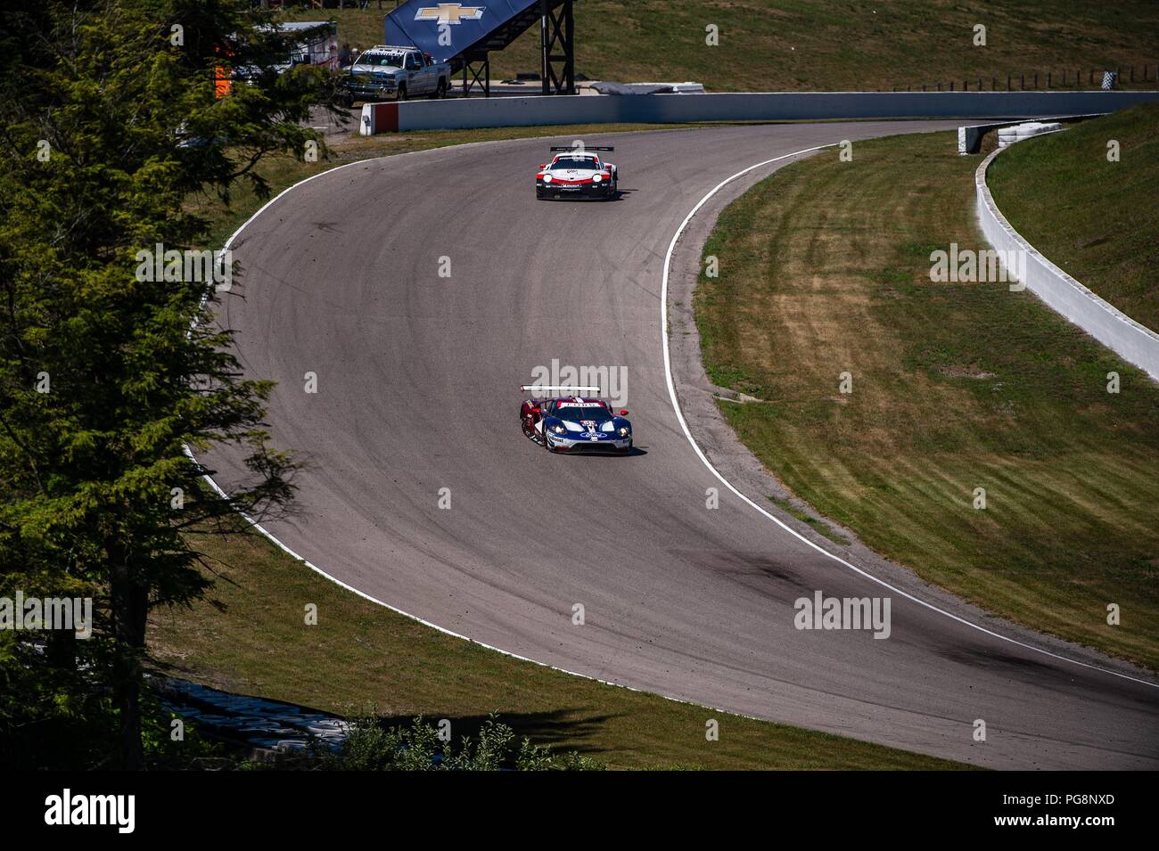 Bowmanville, CAN., 08 Jul 2018. 8th July, 2018. The number 66 Ford GT, driven by the team of Joey Hand and Dirk Mueller, in the GT Le Mans series, endure the off-camber, full throttle, of turn 4 on 08 of July, 2018 at Canadian Tire Motorsport Park during the Mobil 1 SportsCar Grand Prix weekend. Credit: Victor Biro/ZUMA Wire/Alamy Live News Stock Photo