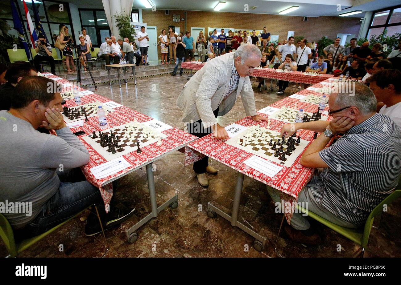 Zagreb, Croatia. 24th Aug, 2018. Russian former chess world champion Garry Kasparov (C) competes during a simultaneous chess exhibition match in Zagreb, Croatia, on Aug. 24, 2018. Credit: Zarko Basic/Xinhua/Alamy Live News Stock Photo