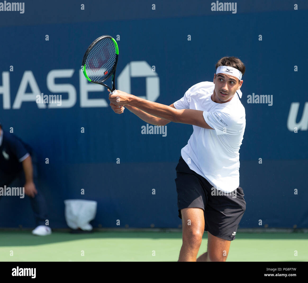 New York, USA - August 24, 2018: Lorenzo Sonego of Italy returns ball  during qualifying day 4 against Collin Altamirano of USA at US Open Tennis  championship at USTA Billie Jean King