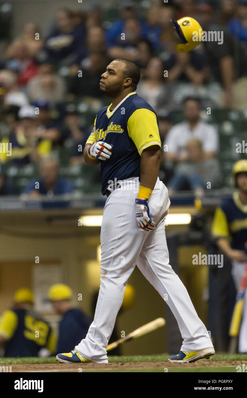 Milwaukee Brewers' Jesús Aguilar (24) flips his bat as he walks in the  second inning of a spring training baseball game against the Texas Rangers,  Tuesday, March 19, 2019, in Phoenix (AP