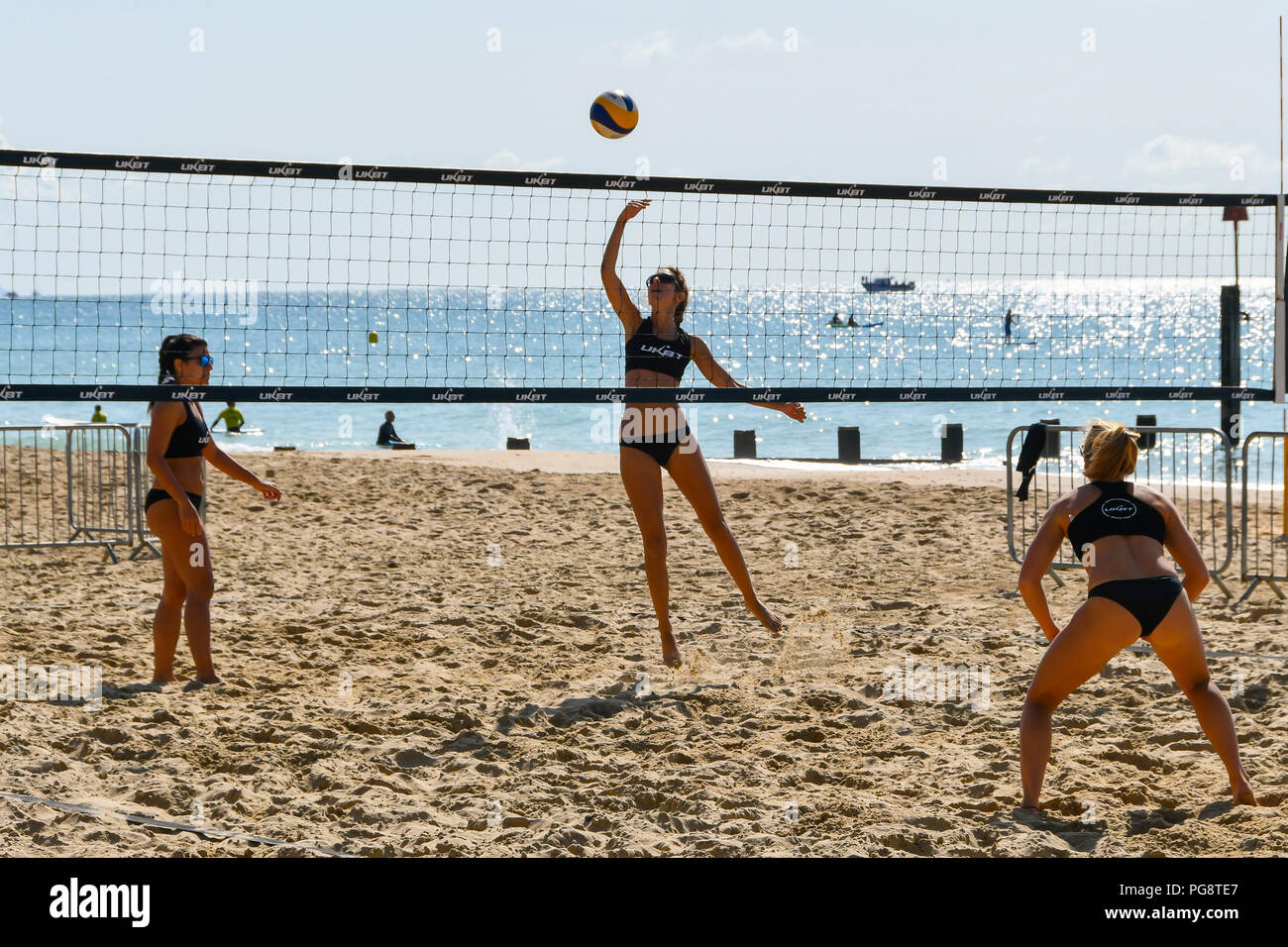 Boscombe, Bournemouth, Dorset, UK.  25th August 2018. UK Weather.  Beach Volleyball players competing in the UK Beach Tour enjoying a morning of warm sunshine and blue skies on the beach at Boscombe near Bournemouth in Dorset.  Picture Credit: Graham Hunt/Alamy Live News Stock Photo