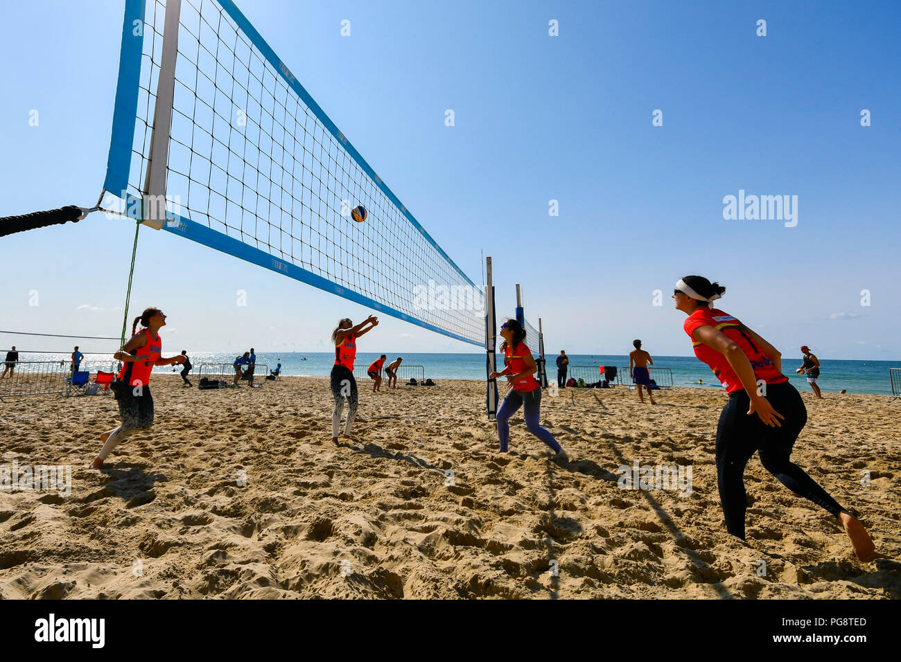 Boscombe, Bournemouth, Dorset, UK.  25th August 2018. UK Weather.  Beach Volleyball players competing in the UK Beach Tour enjoying a morning of warm sunshine and blue skies on the beach at Boscombe near Bournemouth in Dorset.  Picture Credit: Graham Hunt/Alamy Live News Stock Photo