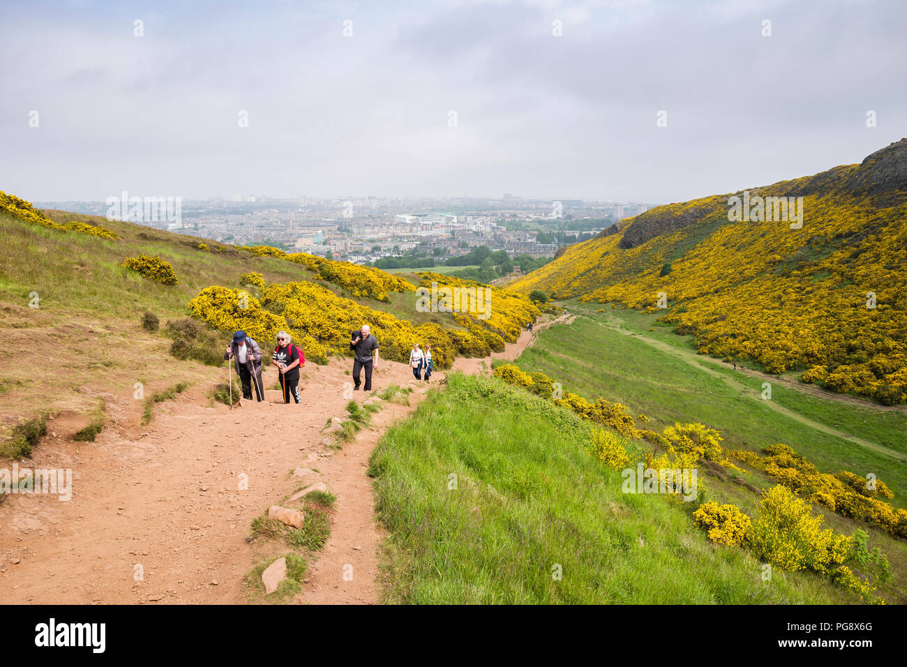 Sunday morning hikers walking the path up Arthur's Seat, Holyrood Park, Edinburgh, Scotland, UK. Stock Photo