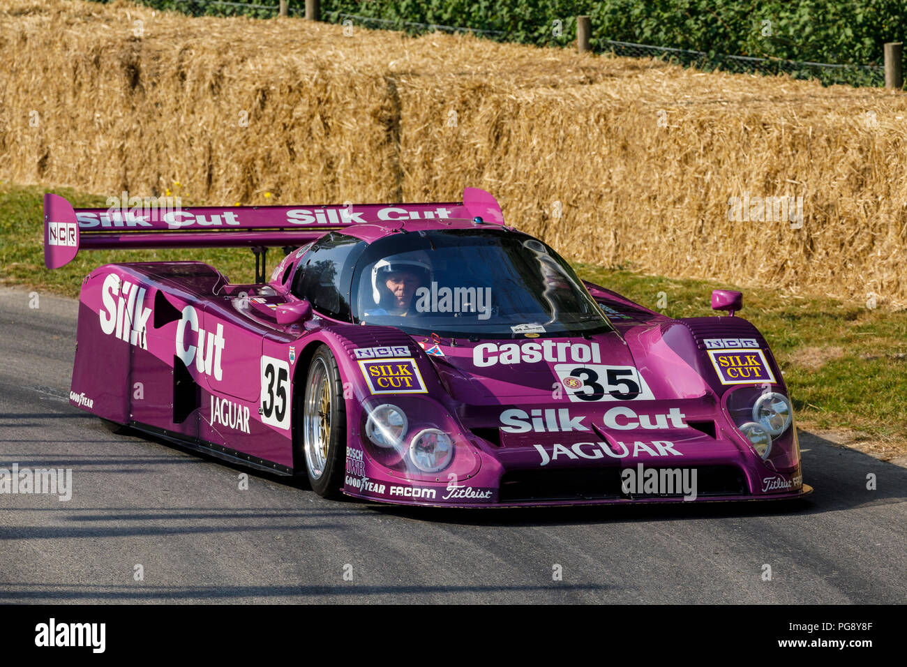 1988 Silk Cut Jaguar XJR-9 LM Le Mans endurance racer with driver Gary Pearson at the 2018 Goodwood Festival of Speed, Sussex, UK. Stock Photo