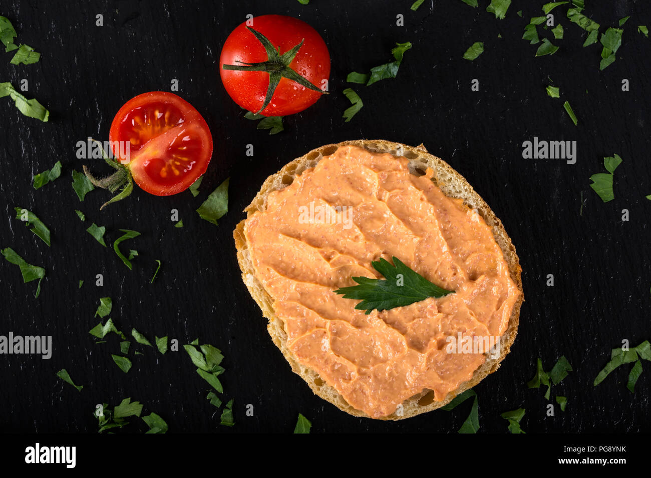 Appetizer made from one slice of bread with cod and almon roe salad - top view Stock Photo