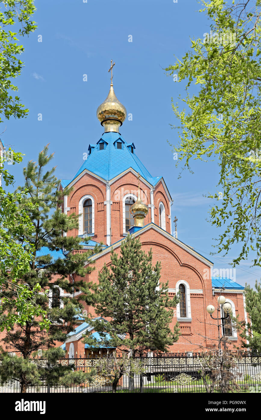 Close up photo of Cathedral of Our Lady of Kazan in Komsomolsk-on-Amur, Russia on sunny summer day Stock Photo