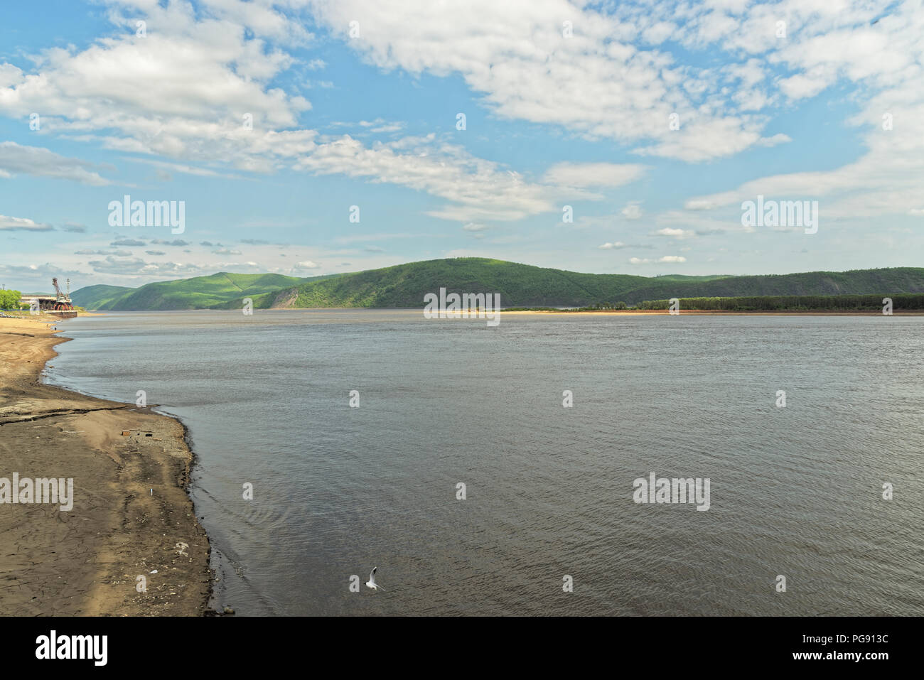 Panoramic view of Amur river against amazing cloudy sky. Komsomolsk-on-Amur, Russia Stock Photo