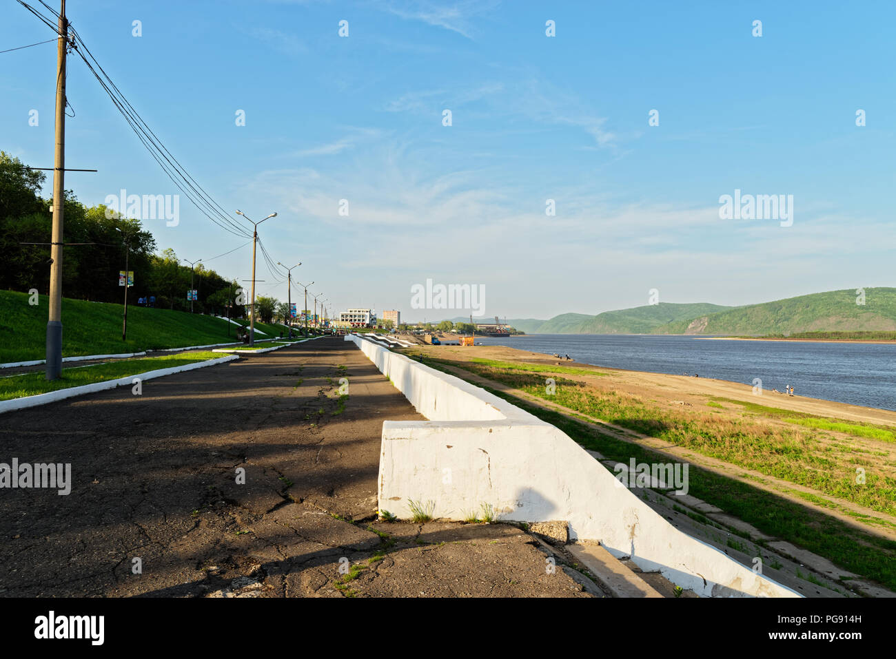 Promenade on the shore of Amur river against blue sky. Komsomolsk-on-Amur, Russia Stock Photo