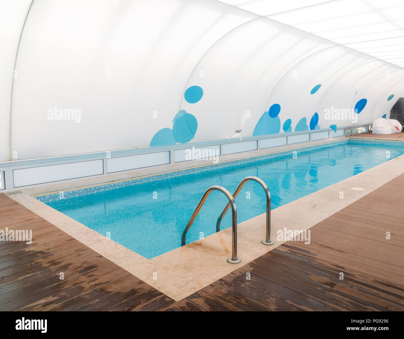 Wide angle view of swimming pool with a roof Stock Photo - Alamy
