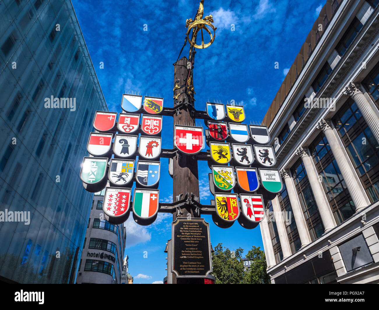 Swiss Canton Tree in London's West End - The Swiss Cantonal Tree in Swiss Court near Leicester Square, erected 1991 as a sign of UK Swiss friendship Stock Photo