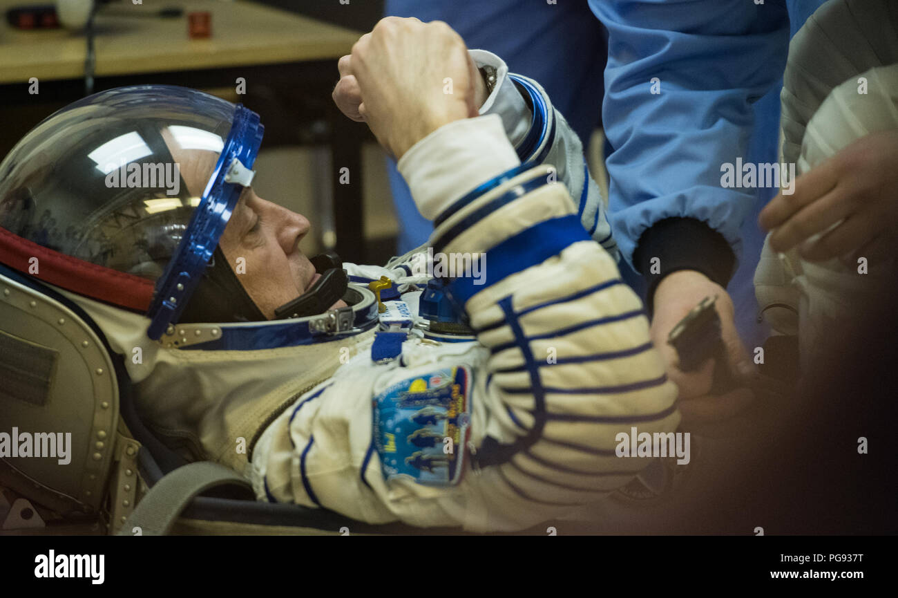 Expedition 55 flight engineer Ricky Arnold of NASA prepares to have his Russian Sokol suit pressure checked in preparation for launch aboard the Soyuz MS-08 spacecraft, Wednesday, March 21, 2018 at the Baikonur Cosmodrome in Kazakhstan. Arnold, Soyuz Commander Oleg Artemyev of Roscosmos, and flight engineer Drew Feustel of NASA launched aboard the Soyuz MS-08 spacecraft at 1:44 p.m. Eastern time (11:44 p.m. Baikonur time) on March 21 to begin their journey to the International Space Station. Stock Photo