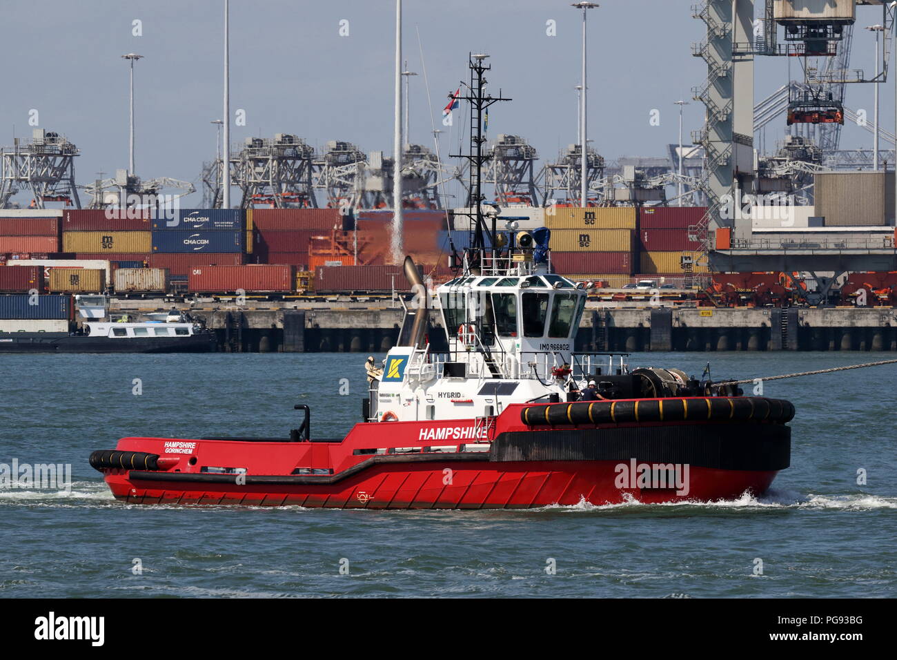 The harbor tug Hampshire works on 13 July 2018 in the port of Rotterdam. Stock Photo
