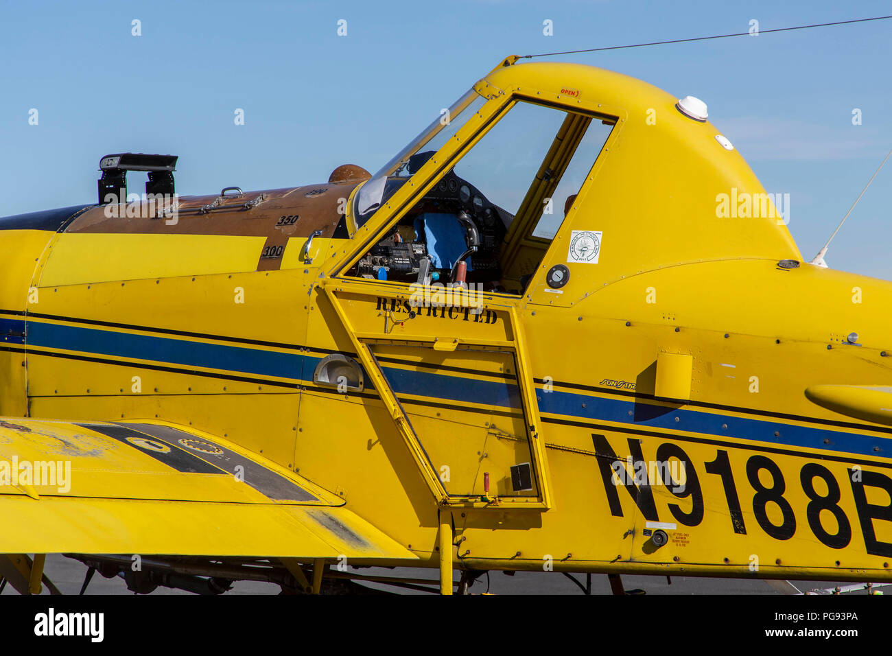 Yellow crop duster plane in a small airport in Pullman Washington Stock Photo