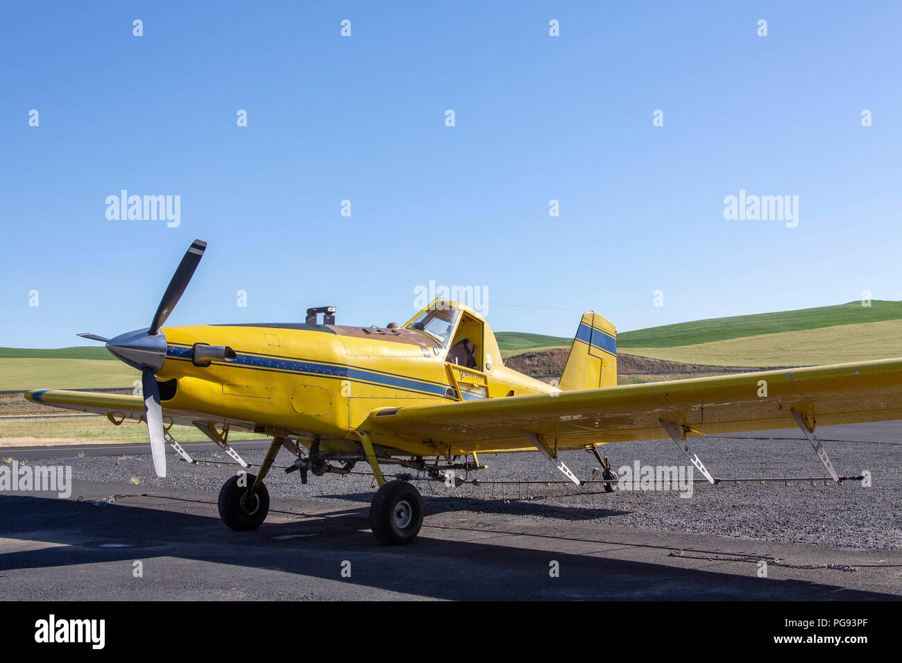 Yellow crop duster plane in a small airport in Pullman Washington Stock Photo