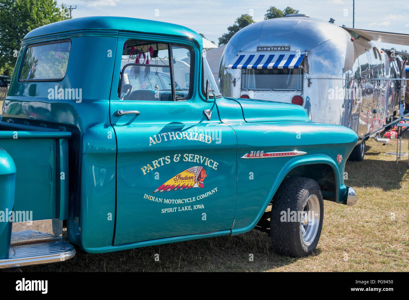 Vintage Chevrolet 3100 pickup truck with an airstream caravan at a vintage retro festival. UK Stock Photo