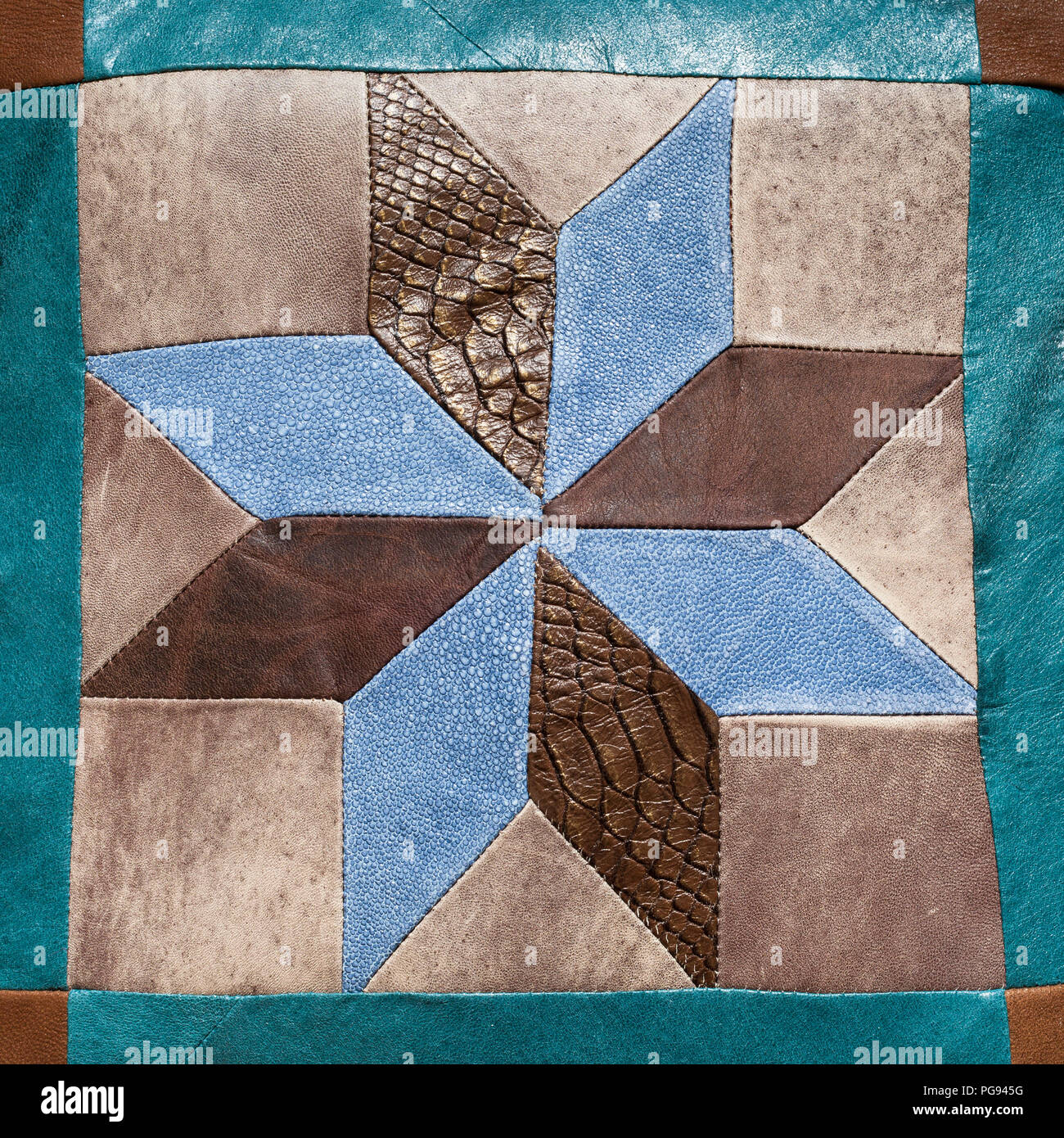 stitched star pattern from leather pieces on decorative pillow Stock Photo