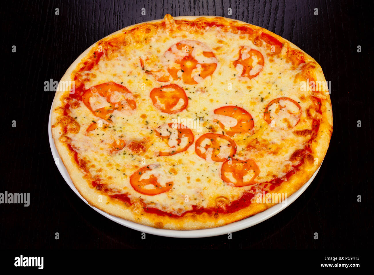 Delicious margarita pizza with tomatoes Stock Photo Alamy