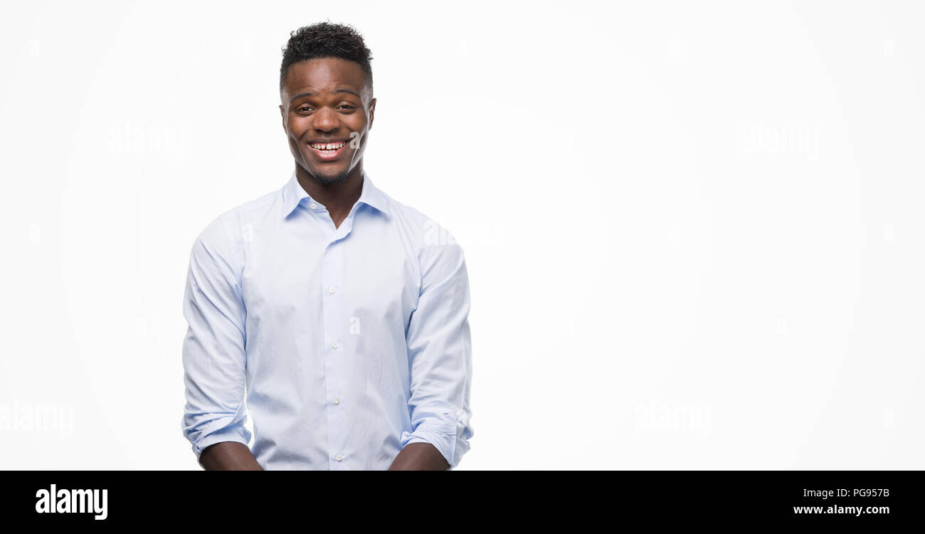 Young african american man wearing a shirt with a happy face standing ...