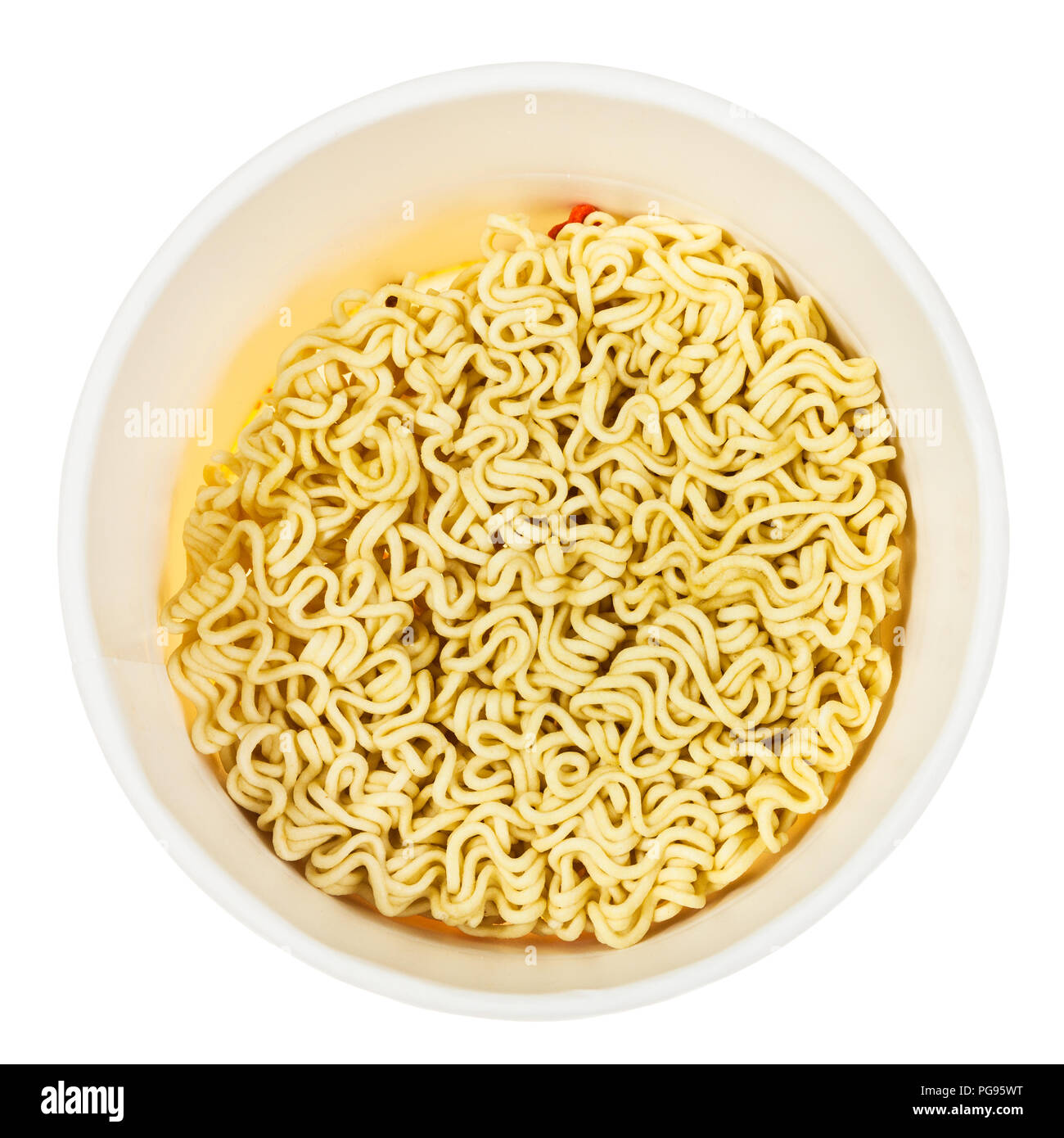 top view of open cup with dried instant noodles isolated on white background Stock Photo