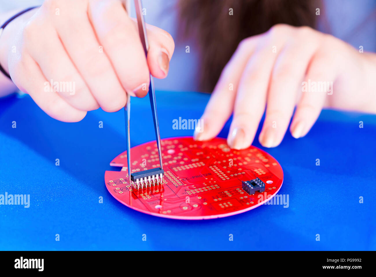 Adding components to printed circuit board Stock Photo - Alamy